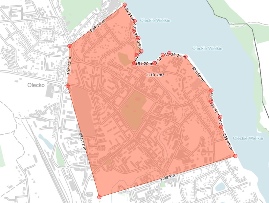 Mapa z zaznaczonym obszarem pomiarowym wyr&oacute;żnionym kolorem, przedstawiająca granice działki lub terenu.